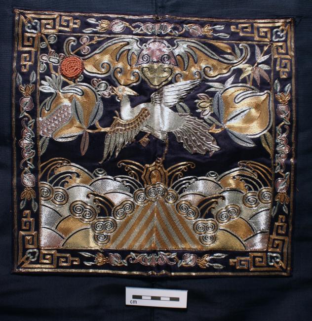 Textile with emboridered crane